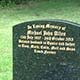 Traditional memorial in polished Emerald Pearl granite